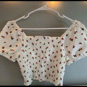 Off the shoulder shirt that has pink flowers